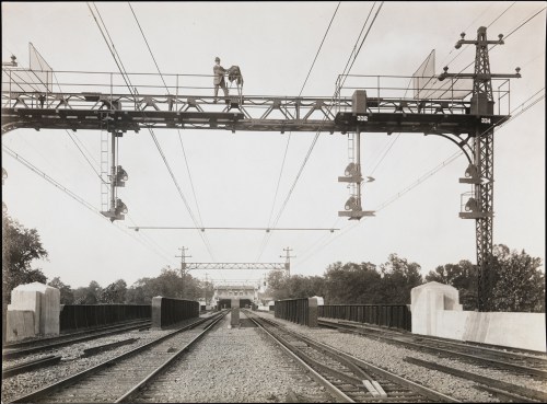 William Davis Hassler, Self Portrait Standing on Superstructure above train tracks, ca. 1917. Museum of the City of New York, 01.35.1.45.
