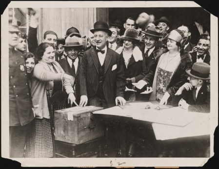 Smith and members of his family at the Oliver Street polling station. 1924. Museum of the City of New York. f2012.58.1175