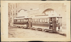 Photograph taken for the John Stephenson Company by unknown photographer. Cable Cars Kansas City Railway Co. Nos. 18 and 17 streetcars, Woodland Avenue via 8th & 9th to Union Depot. ca. 1885. Museum of the City of New York. 44.295.451