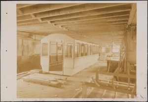 Photograph taken for the John Stephenson Company by unknown photographer. Factory Interior of the John Stephenson Company factory at 47 East 27th Street, streetcar near completion. ca. 1889. Museum of the City of New York. 44.295.481