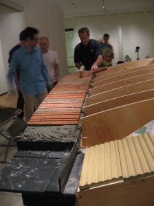 Another view of the same  - the steel frame is visible in the foreground, and a third layer of terracotta tile has been installed.