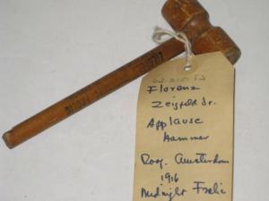 Souvenir - wooden applause hammer from Ziegfeld's Midnight Frolic atop New Amsterdam Theatre, ca. 1916. Museum of the City of New York, 62.215.53.