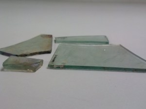 Crown window glass fragments of varying thickness