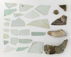 An assortment of glass fragments unearthed in City Hall Park. Are they bottle glass? 19th Century plate glass? Or earlier, hand spun, crown glass? Read on to find out more!