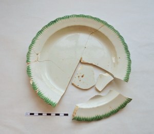 Ceramic pearlware dish with green shell-edged design. Shell-edged dishes were one of the cheapest wares with color decoration during the late 18th to mid 18th century.