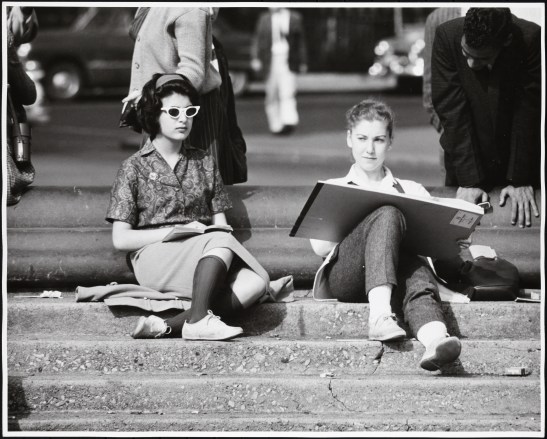Nat Norman, ca. 1956, [81.114.43]: Girl with sketchpad on fountain steps, Washington Square Park