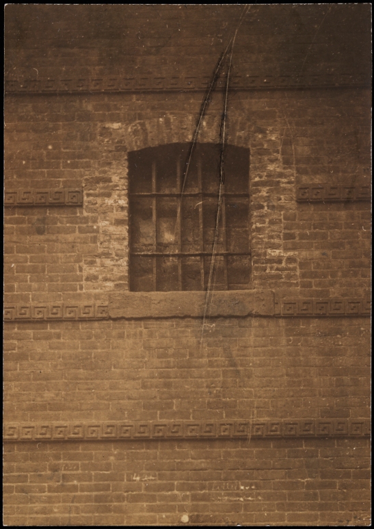 [Detail of window from Old Sugar House in Rhinelander Building.]
