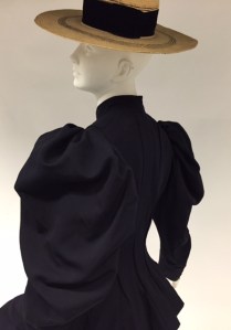Bicycling Ensemble, ca. 1895, Navy wool broadcloth; brimmed leghorn straw hat originally worn with ensemble. Gift of Mrs. John Hubbard, 41.190.23a-d; 41.190.3 (hat)