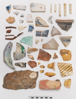 Fragments of pottery, tiles, nails, stone, and smoking pipes from the South Ferry Terminal Collection. Image courtesy of the Museum of the City of New York.