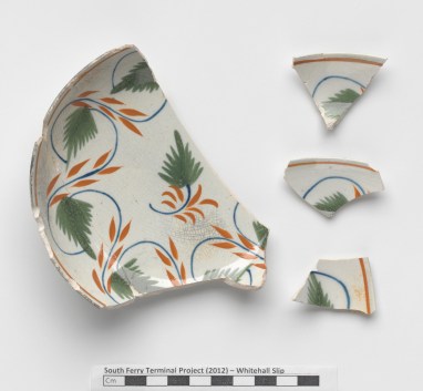 Fragments of a brightly painted saucer from Whitehall Slip.
