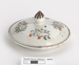 A painted teapot lid from Whitehall Slip.