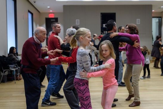 Participants in Family Salsa Lesson with Nysalsababy Dance-Latin Soul Dance Project. Photograph by Filip Wolak Courtesy MCNY.